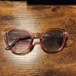 Plastic soft pink sunglasses.